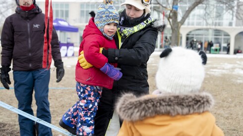 Lily, 2, tries to walk on a slack line while being helped by Kayla Kroot during Polar Adventure Days at Northerly Island, Saturday, Jan. 24, 2026.