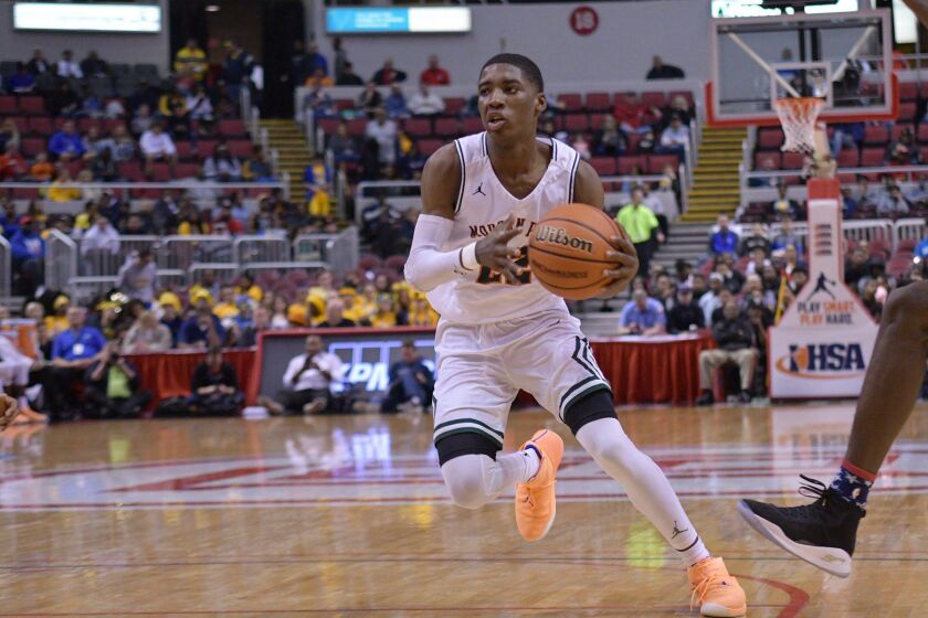 Morgan Park’s Marcus Watson (22) side steps a defender in Peoria. Worsom Robinson/For the Sun-Times.