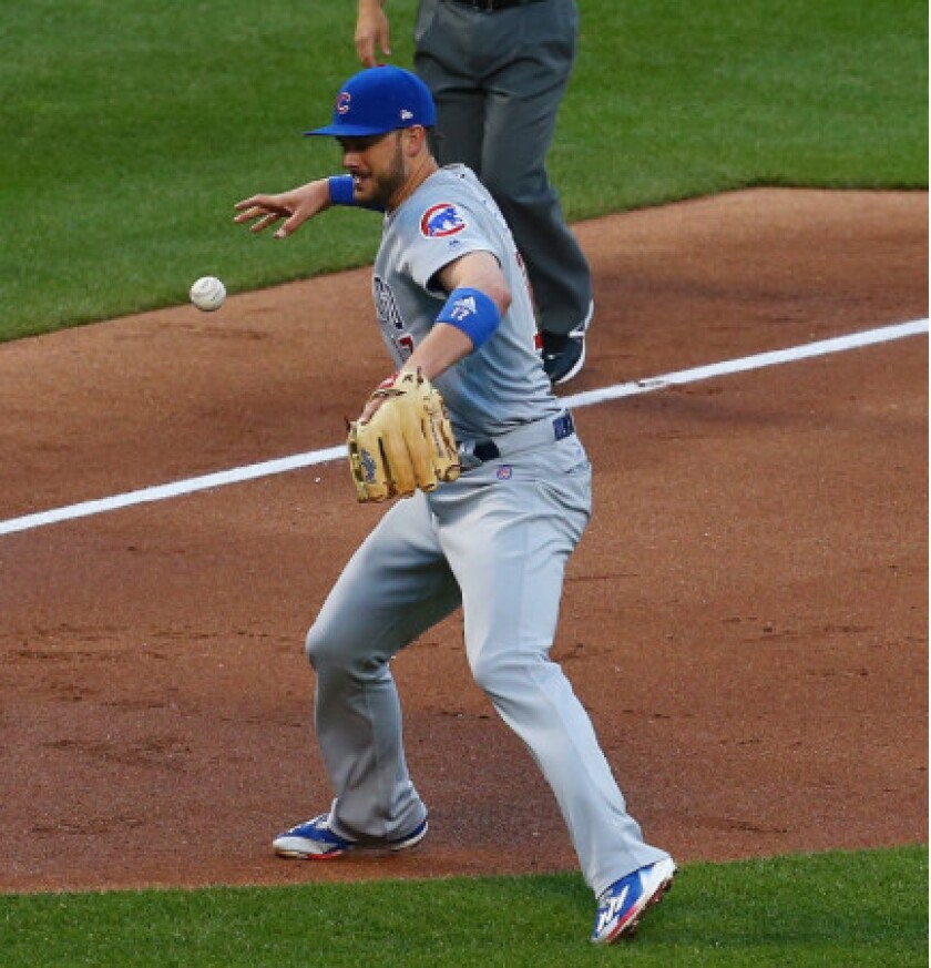 <em>Kris Bryant loses his grip on a second-inning play that led to an unearned run.</em>