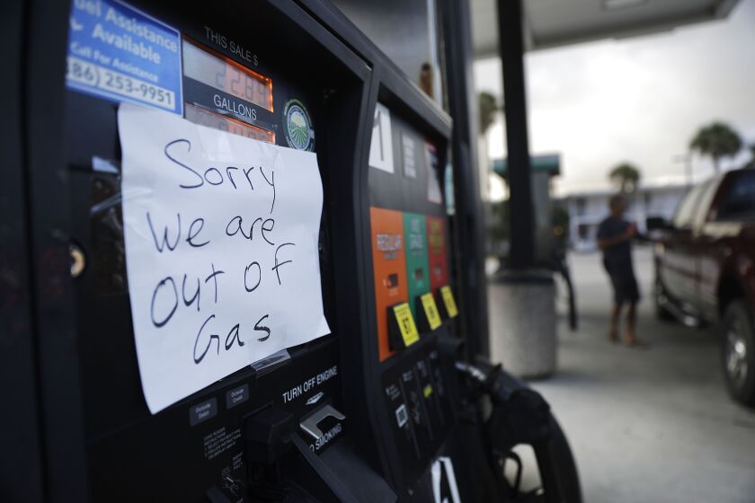 A note is posted to a gas pump after the station ran out of gas ahead of Hurricane Irma in Daytona Beach, Fla. on Friday. Coastal residents around South Florida have been ordered to evacuate as the killer storm closes in on the peninsula for what could be