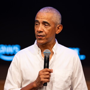 Former President Barak Obama surprises a group of high school freshman girls Friday during the WNBA Changemaker Day at the Obama Presidential Center in Jackson Park on the South Side.
