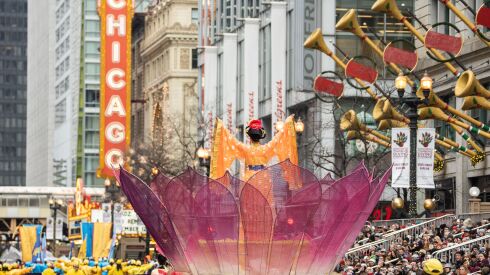 A float by the group Falun Dafa travels down State Street during the annual Thanksgiving Day Parade in the Loop, Thursday, Nov. 24, 2022.