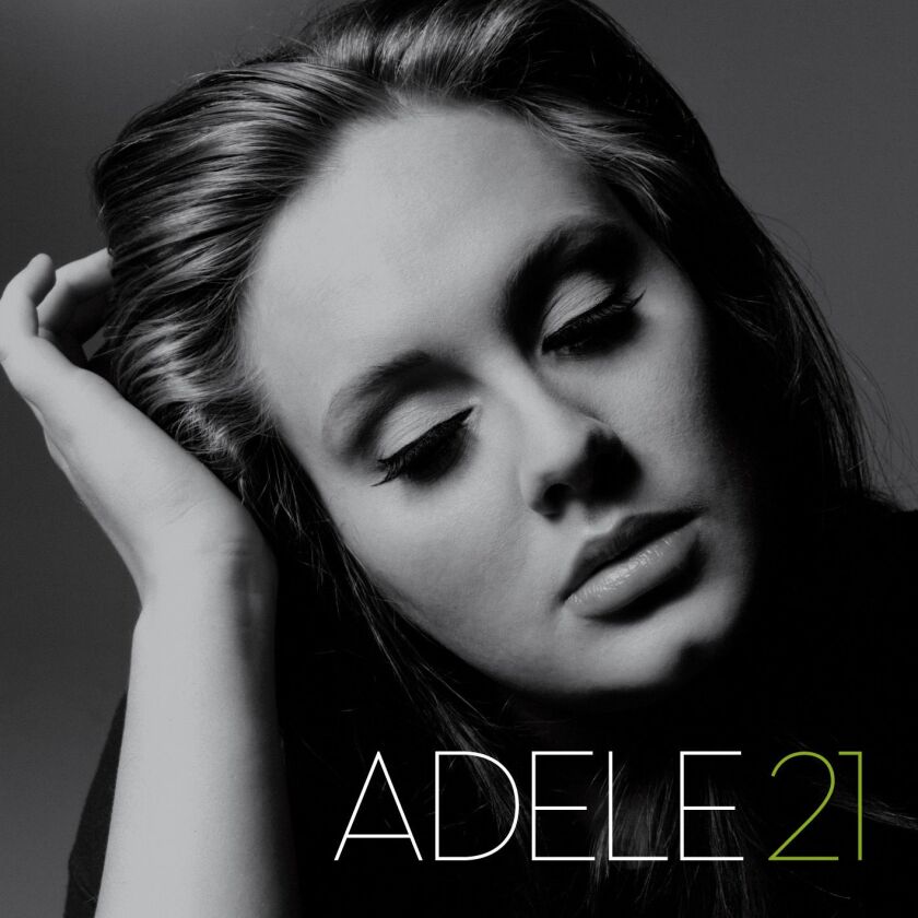 This cover image released by Columbia shows “21” by Adele.