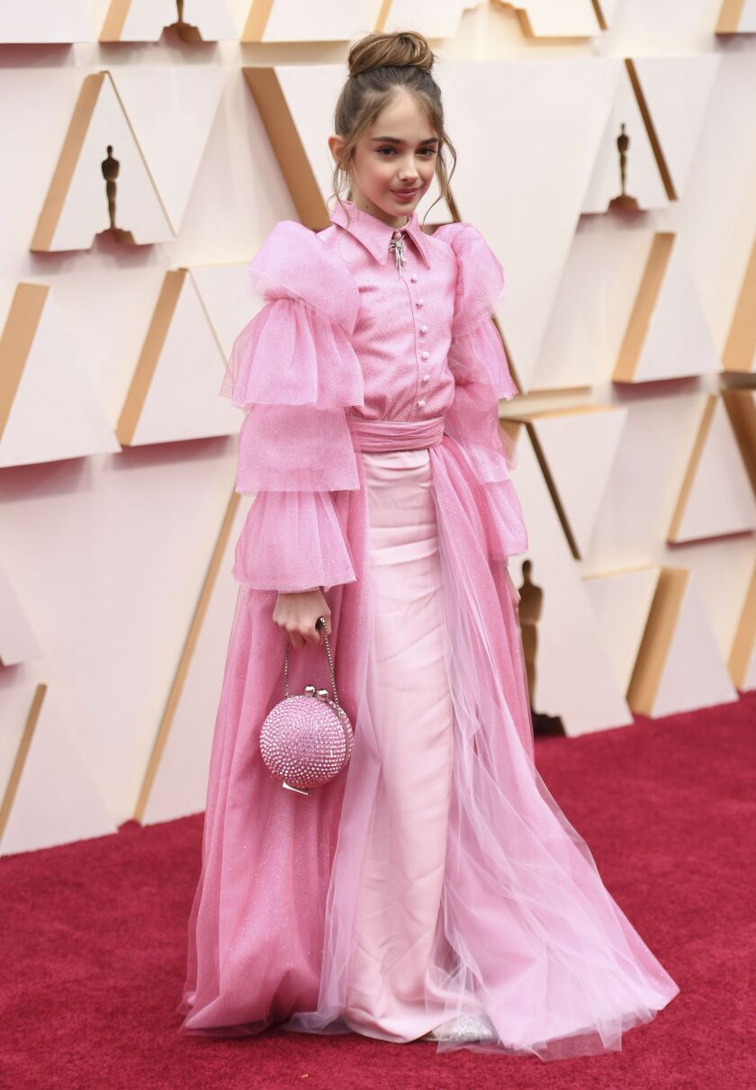 Ten-year-old Julia Butters, currently featured in “Once Upon a Time in Hollywood,” arrives at the Oscars on Sunday in Los Angeles. Butters collaborated with designer Christian Siriano on her pink gown and accessories.