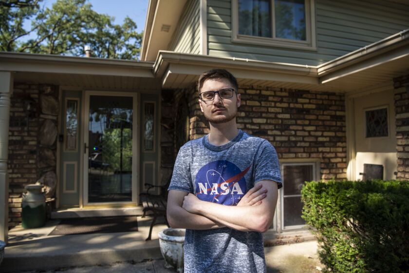 Dean Darhussein a undergraduate majoring in physics at the University of Illinois at Urbana-Champaign stands in front of his Tinley Park home, Wednesday, Aug. 12, 2020. Darhussein like many college students will be staying home and taking classes online amid the coronavirus pandemic. | Tyler LaRiviere/Sun-Times