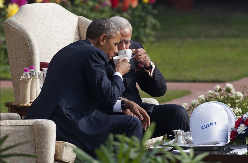 Indian Prime Minister Narendra Modi (R) and US President Barack Obama sit and talk in the gardens between meetings at Hyderabad House in New Delhi on January 25, 2015. SAUL LOEB/AFP/Getty Images