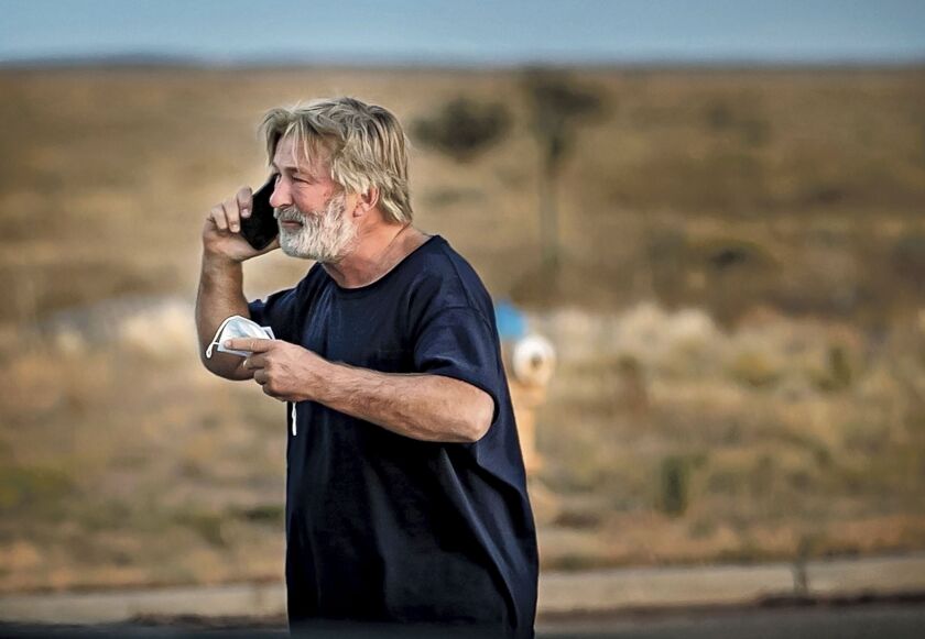 Alec Baldwin speaks on the phone in the parking lot outside the Santa Fe County Sheriff’s Office in Santa Fe, N.M., on Thursday, Oct. 21, 2021 after he was questioned about a shooting on the set of the film “Rust” on the outskirts of Santa Fe.
