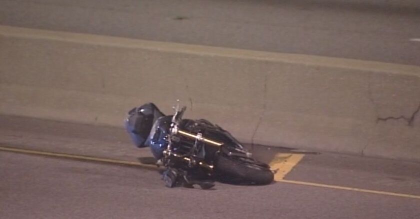 A motorcycle lies on its side after a fatal crash on I-290 early Sunday. | Network Video Productions