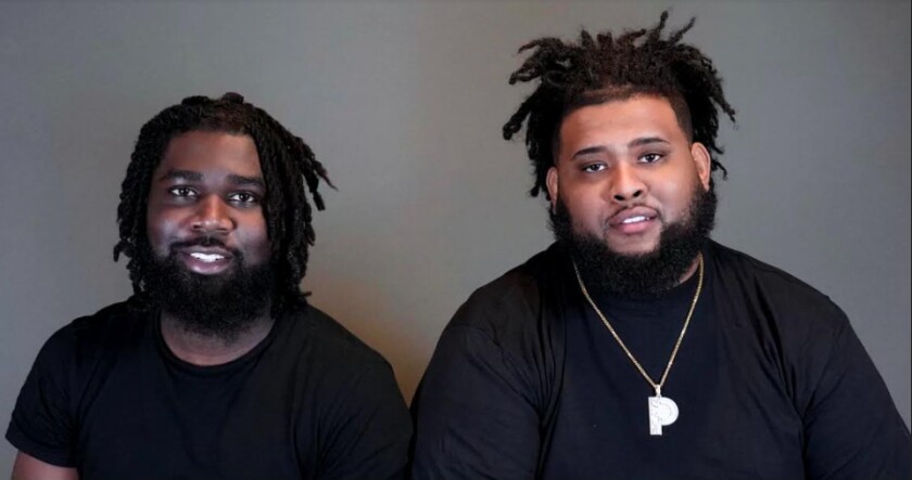 Andrew Bonsu (left) and Phil Simpson are co-owners of University Village-based restaurant Phlavz Bar & Grille.