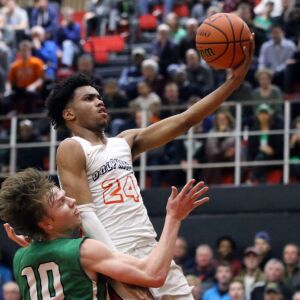Whitney Young’s Tyler Beard (24) drives to the basket against York’s Nathan Shockey (10) in their 58-56 victory in Hillside, Wednesday, March 6, 2019. | Kevin Tanaka/For the Sun Times