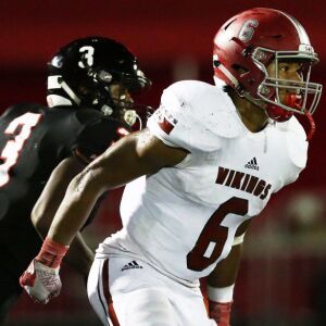 Homewood-Flossmoor’s Justin Whiteside (6) defends a Bolingbrook receiver, Homewood-Flossmoor’s Dominick Jones (8) completes a pass. Allen Cunningham/For the Sun-Times.