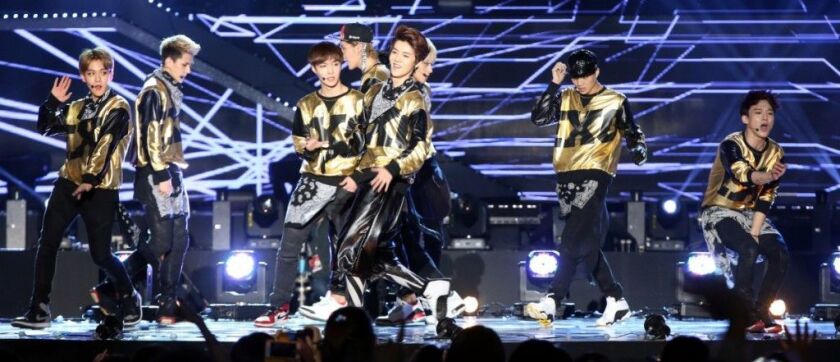 South Korean band EXO performing in 2014. | Photo by Starnews/AFP/Getty Images