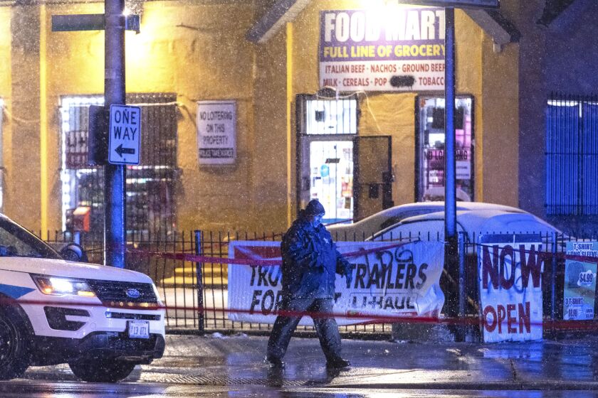 Chicago police investigate the scene where multiple people were shot and one was killed in the 7900 block of South Avalon, Tuesday, Feb. 25, 2020.