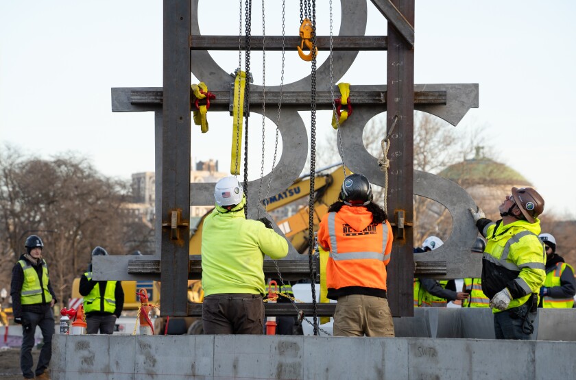 The first panel of the screen text is installed at the Obama Presidential Center.