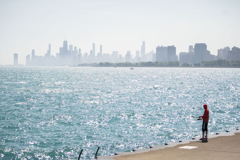 A person goes fishing by Lake Michigan near Montrose Beach, Thursday, Sept. 8.