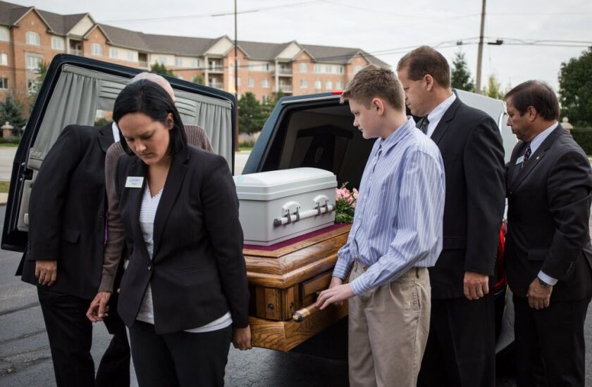Fifteen-year-old Joseph Matusiewicz (center) was among the pallbearers. | Santiago Covarrubias/Sun-Times