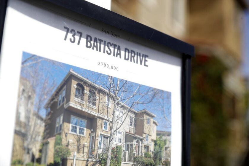 A flyer lists the price of this townhome for sale in San Jose at nearly $800,000 – a ‘bargain’ in that part of the country. (AP Photo/Marcio Jose Sanchez)