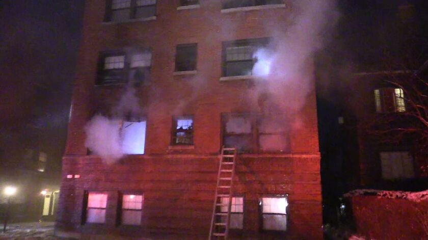 A resident and four police officers were injured in a fire in west suburban Berwyn early Wednesday. / photo from Network Video Productions