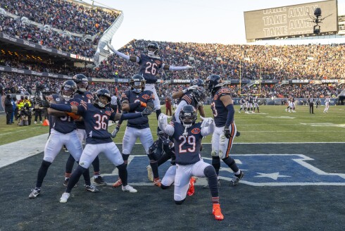 Bears defensive back Zah Frazier, center, celebrates with teammates after catching an interception during the fourth quarter against the Cleveland Browns at Soldier Field on Sunday, Dec. 14, 2025.