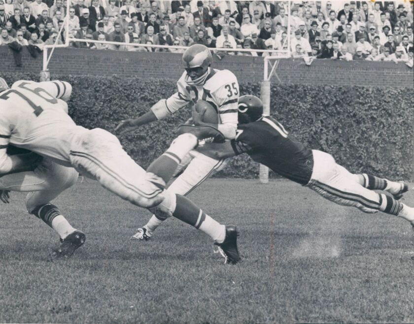 Richie Petitbon tackles an Eagles player at Wrigley Field in 1963.