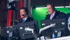 CBS broadcaster Tony Romo, left, calls an AFC wild card playoff game between the Buffalo Bills and the Denver Broncos in Orchard Park, N.Y., on Jan. 12, 2025.