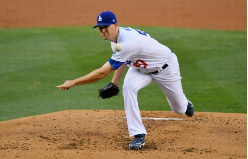 <em>Dodgers starter Alex Wood (6-0) struck out eight in five innings, extending his scoreless streak to 25 1/3 innings.</em>