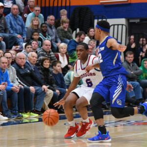 Curie’s Trevon Hamilton (5) dribbles past Bloom’s Dante Maddox Jr. (12) (12)Saturday 12-29-18. Worsom Robinson/For Sun-Times