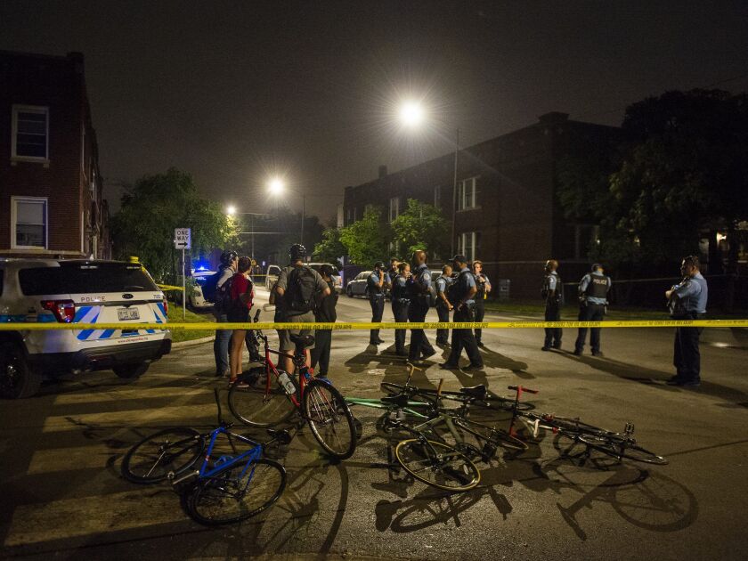 Police investigate a person shot Tuesday morning in the 600 block of East 76th. | Tyler LaRiviere/Sun-Times