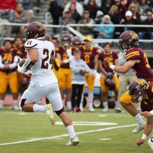 Montini’s Nicholas Fedanzo (24) breaks a kickoff return. Allen Cunningham/For the Sun-Times.
