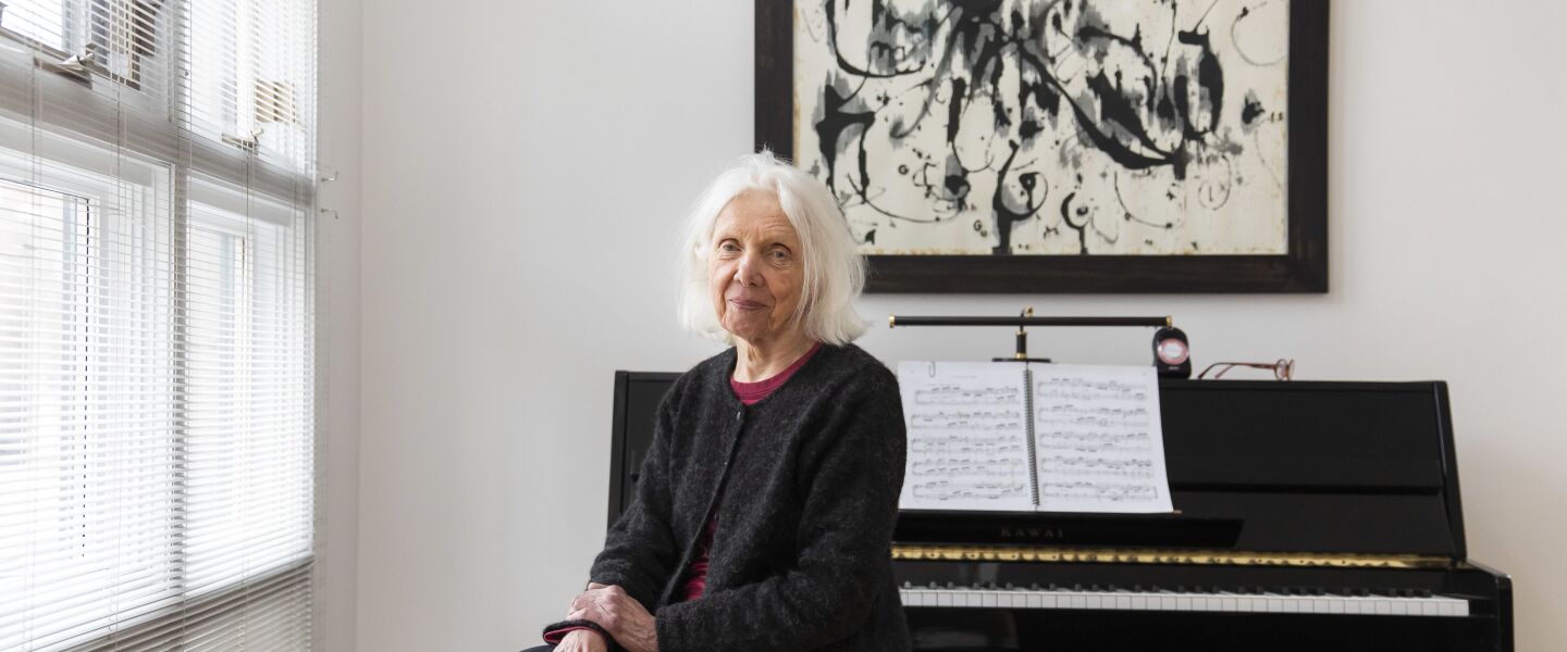 Artist Irene Siegel inside her Chicago home with one of her works.