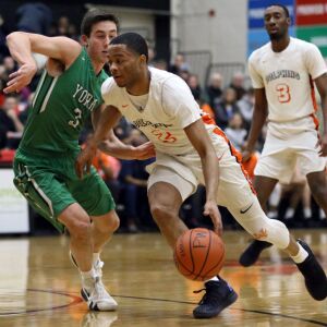 Whitney Young’s Myles Baker (2) drives around York’s Nicholas Kosich (3) in their 58-56 win in Hillside, Wednesday, March 6, 2019. | Kevin Tanaka/For the Sun Times