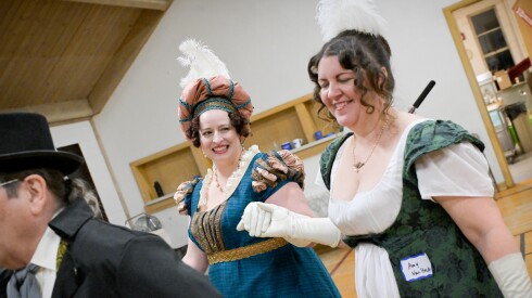 Kat Lee and Amy Van Hecke of Milwaukee take part in the Chicagoland English Country Dance’s Regency Ball in honor of the 250th anniversary of Jane Austen’s birth at Grace Lutheran Church in Glen Ellyn on Saturday, Dec. 13, 2025.