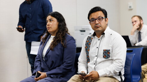 Mayra Macias, left, and Ald. Byron Sigcho-Lopez (25th), independent candidates vying for U.S. Rep. Jesús “Chuy” García’s congressional seat, attend a Tuesday hearing at the offices of the Illinois State Board of Elections.