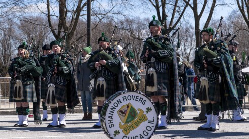 The Shannon Rovers ready their pips before the St. Patrick’s Day Parade in downtown Chicago, Saturday, March 12, 2022.