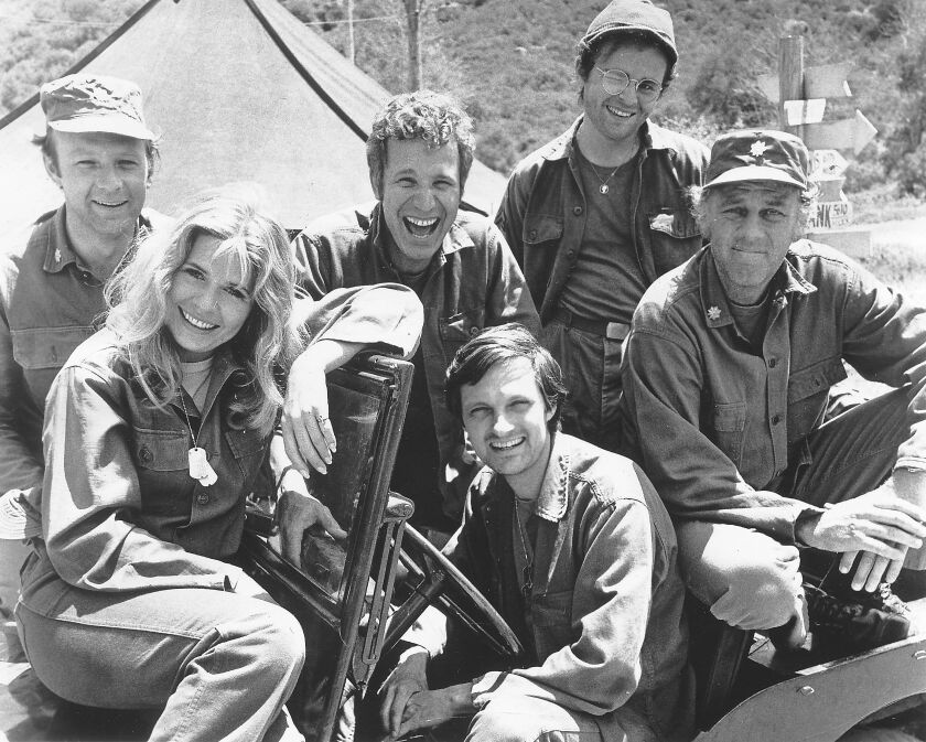 The original cast of “MASH” included Alan Alda (in the driver’s seat) and (from left) Larry Linville, Loretta Swit, Wayne Rogers, Gary Burghoff and McLean Stevenson.