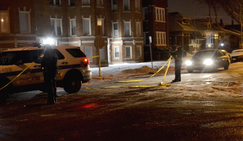 Officers respond to a shooting at a party early Sunday that left one man dead and another wounded in the 1500 block of West 80th Street. | Justin Jackson/Sun-Times
