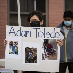 People gather for a vigil for 13-year-old Adam Toledo near the location of the shooting at West 24th Street and South Sawyer Avenue in Little Village, Monday afternoon, April 5, 2021. Toledo was fatally shot in the chest by a Chicago police officer in an alley west of the 2300 block of South Sawyer Avenue near Farragut Career Academy High School.