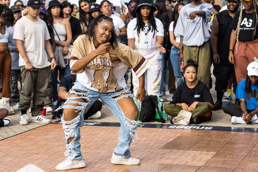 A hip-hop dancer performs during “Youth of Chinatown,” a three-day event featuring hip-hop and K-pop performances at Chinatown Square Plaza, Saturday, Aug. 27, 2022.