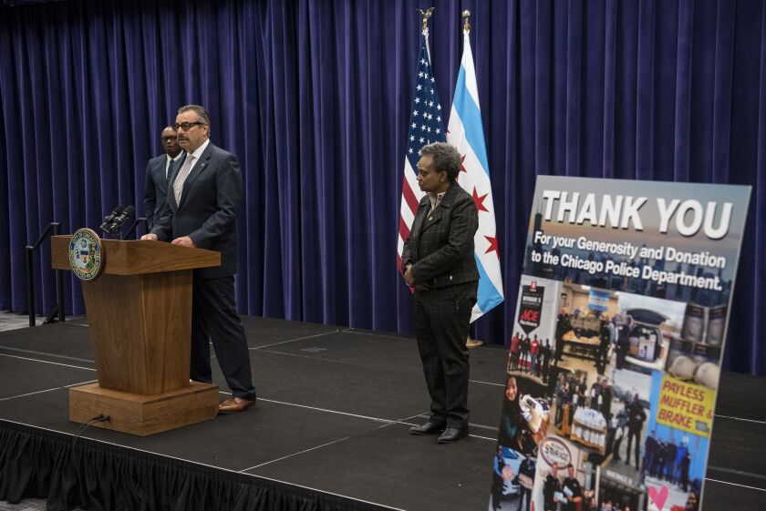 Interim Chicago Police Supt. Charlie Beck (at lectern) appeared at CPD headquarters Friday with Mayor Lori Lightfoot (right) and the man Lightfoot has picked as Beck’s successor, David Brown (background left).