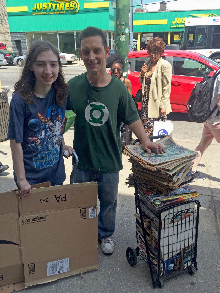 Ed Pliml and Danny, his daughter, arrived early but still had to wait in line to stock up on old issues of Rolling Stone magazine. | Virginia Barreda/For the Sun-Times