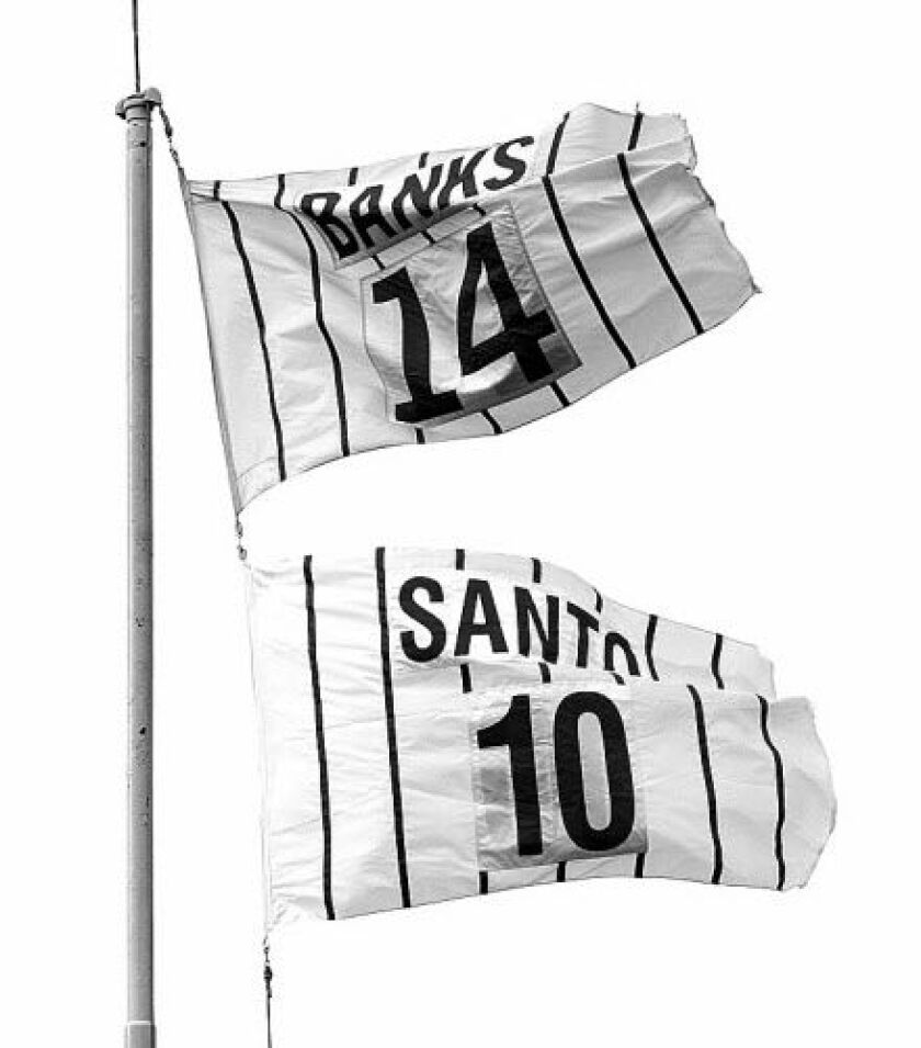 Ron Santo’s retired No. 10 flies with Ernie Banks’ No. 14 on the left field foul pole at Wrigley Field in 2003. | Sun-Times library