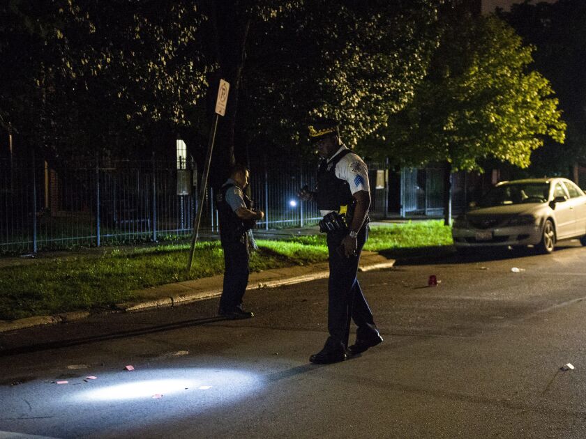 Police investigate a shooting about 11 p.m. Monday in the 7200 block of South Bennett | Tyler LaRiviere/Sun-Times