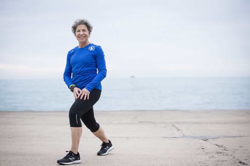 Gayle McMurry trains for the Boston Marathon on the Lakeshore Path on Monday in Chicago. McMurry will run with other members of 261 Fearless, a global network for women around the world to connect, support and inspire one another through running. The grou