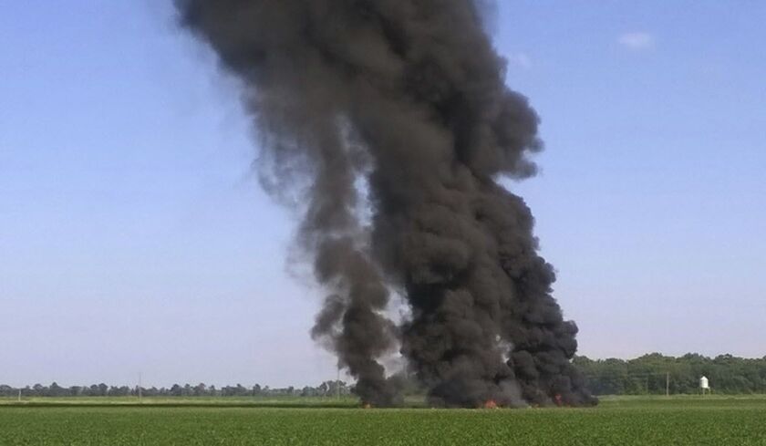 In this photo provided by Jimmy Taylor, smoke and flames rise into the air after a military transport airplane crashed in a field near Itta Bena, Mississippi, on the western edge of Leflore County, on Monday. | Jimmy Taylor via AP