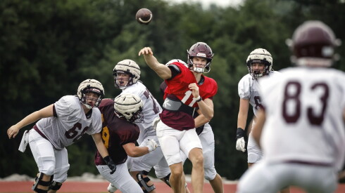 Loyola’s Matthew Lee (11) passes during preseason practice.
