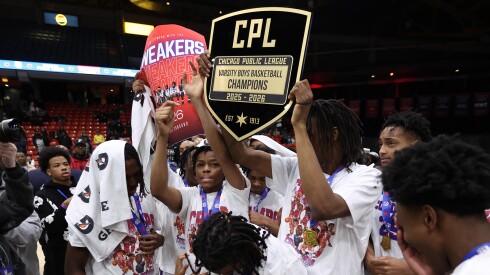 Curie celebrates its Public League championship victory over Lincoln Park.