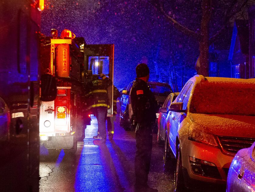 Chicago police and fire department respond to the scene of a person shot and killed Sunday morning in the 5200 block of South Artesian, in the Gage Park neighborhood. | Tyler LaRiviere/Sun-Times