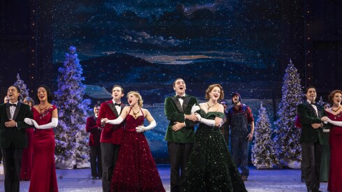 Evan C. Dolan (Phil Davis), Jessie J. Potter (Judy Haynes, both in red), Alex Syiek (Bob Wallace) and Sophie Grimm (Betty Haynes, both in green) lead the cast in the finale of Irving Berlin’s White Christmas.