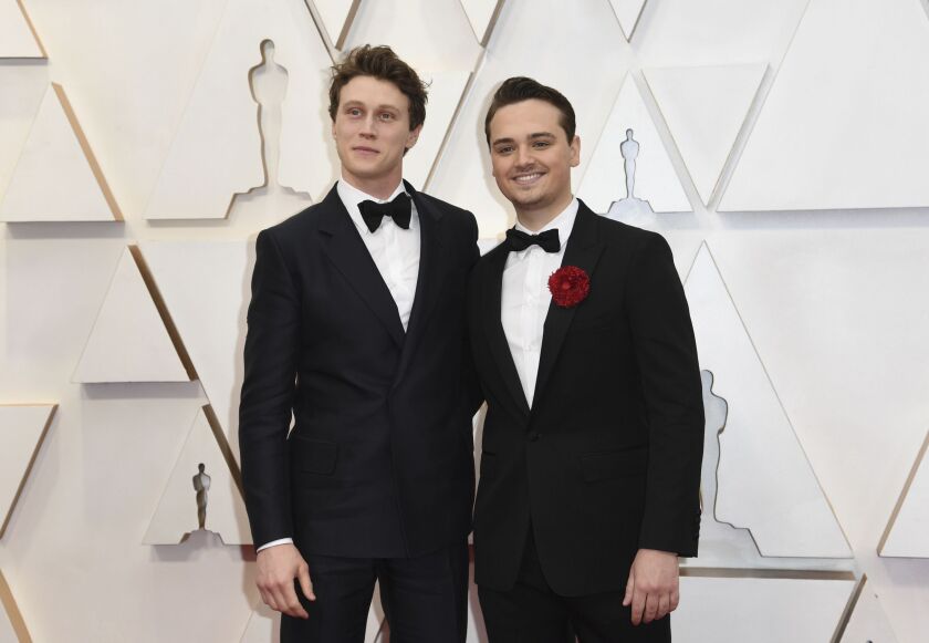 George MacKay (left) and Dean-Charles Chapman, currently starring in the Oscar-nominated “1917” arrive at the Oscars on Sunday night.