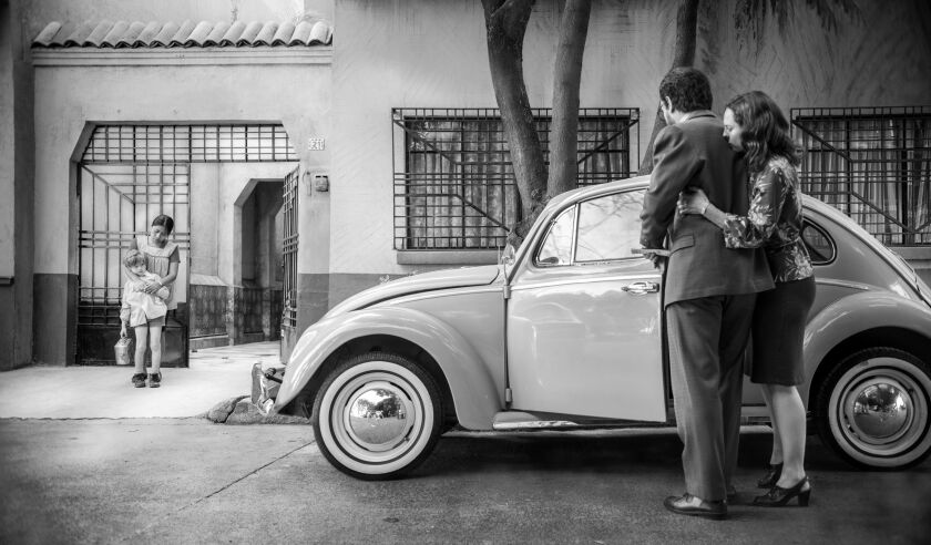 Yalitza Aparicio (left, with Marco Graf) plays a maid in the employ of a doctor (Fernando Grediaga) and his stay-at-home wife (Maria De Tavira) in “Roma.” | Netflix